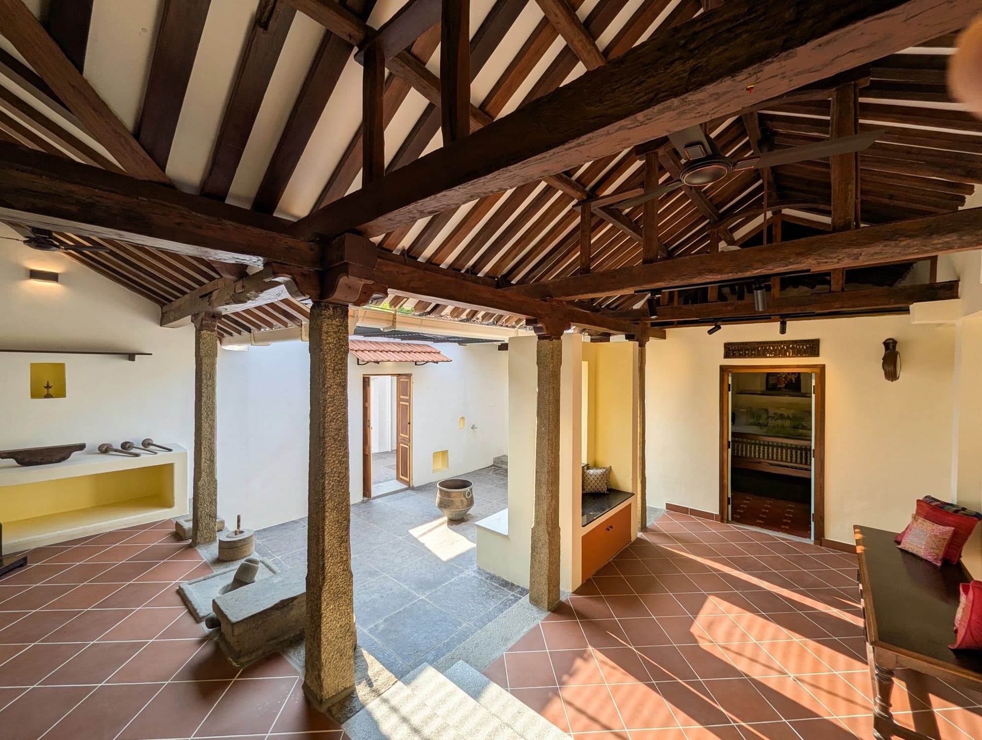 xl_46. Laya Living Room 2- Under high, intricate beams, Laya Living Room's open design beautifully connects its traditional spaces to the sunlit courtyard.